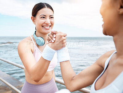 Buy stock photo Handshake, beach and happy fitness friends excited with training targets, exercise and workout goals outdoors. Smile, happiness and healthy women with girl power shaking hands with pride and joy 