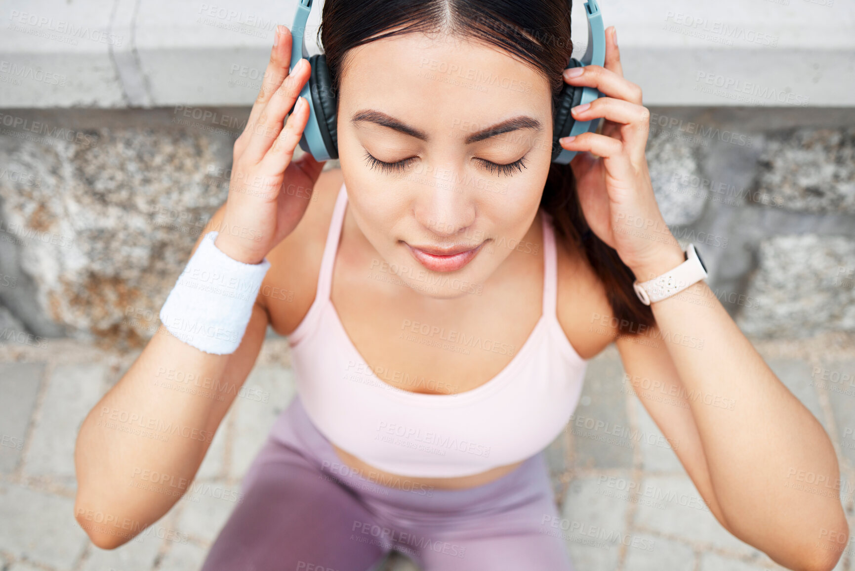 Buy stock photo Yoga, headphones and woman listening to music for zen, calm and peace meditation in the city. Health, fitness and girl from Canada doing a pilates exercise with wellness audio, podcast or radio.