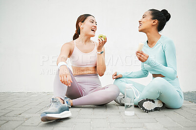 Buy stock photo Fitness women, laughing and eating fruit on training, weight loss exercise and workout break by Canada city wall. Smile, happy and bonding sports people or friends with apple, banana and health food