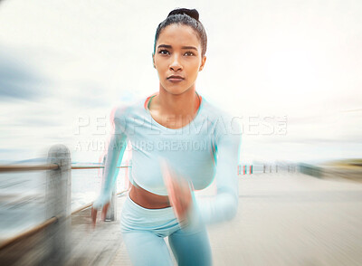 Buy stock photo Woman, running and exercise motion blur by ocean, sea or promenade for health, fitness and wellness. Sports, runner and female from India out for run, training or cardio workout outdoors by seashore
