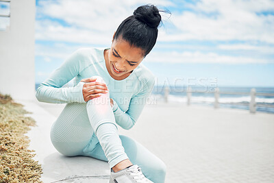 Buy stock photo Fitness, exercise and injury with a sports woman on the beach for a workout, training or to go running. Pain, knee and anatomy with a female athlete suffering with a torn ligament or inflammation