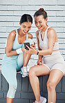 Women, phone and laughing after city fitness, training and exercise for health, wellness or cardio health. Smile, happy or funny sports friends, people and runners with social media mobile technology