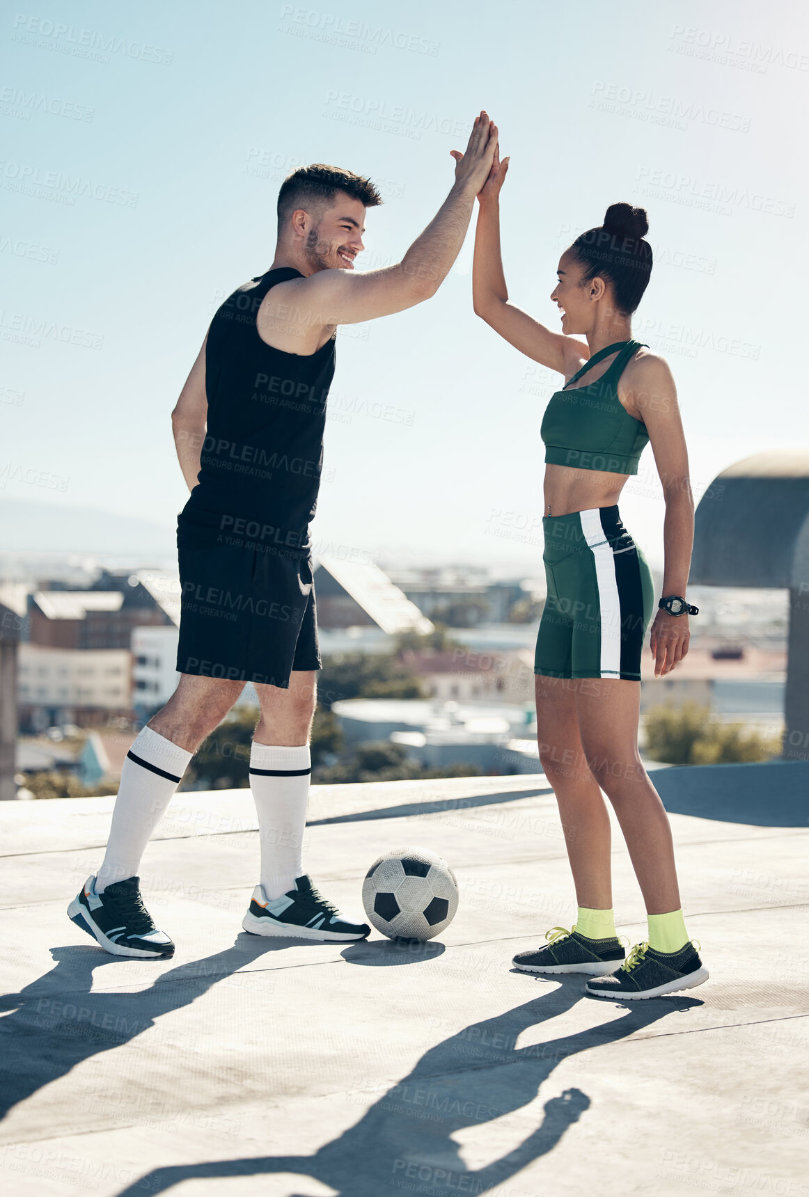 Buy stock photo High five, happy and football friends for celebration, winner and partnership with success, goal and support in a city. Soccer, team and happy football people with ball, motivation or fitness outdoor