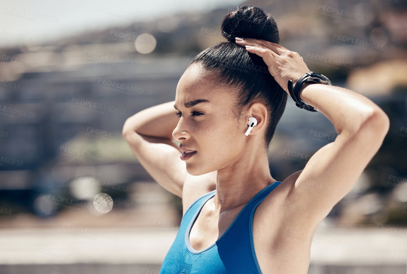 Buy stock photo Fitness, earbuds and woman doing stretching exercise while listening to music, podcast radio. Health, wellness and athlete preparing for workout on outdoor rooftop in city with audio for motivation.