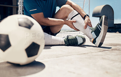 Buy stock photo Football, fitness or man with leg injury while training, exercise or soccer workout on roof of building outdoor. Wellness, health or soccer player with muscle pain, bone emergency or sports accident