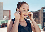 Fitness, music and woman with earpods and smile on rooftop for outdoor workout, exercise or yoga. Sports, training and streaming happy motivation playlist or meditation podcast on app with headphones