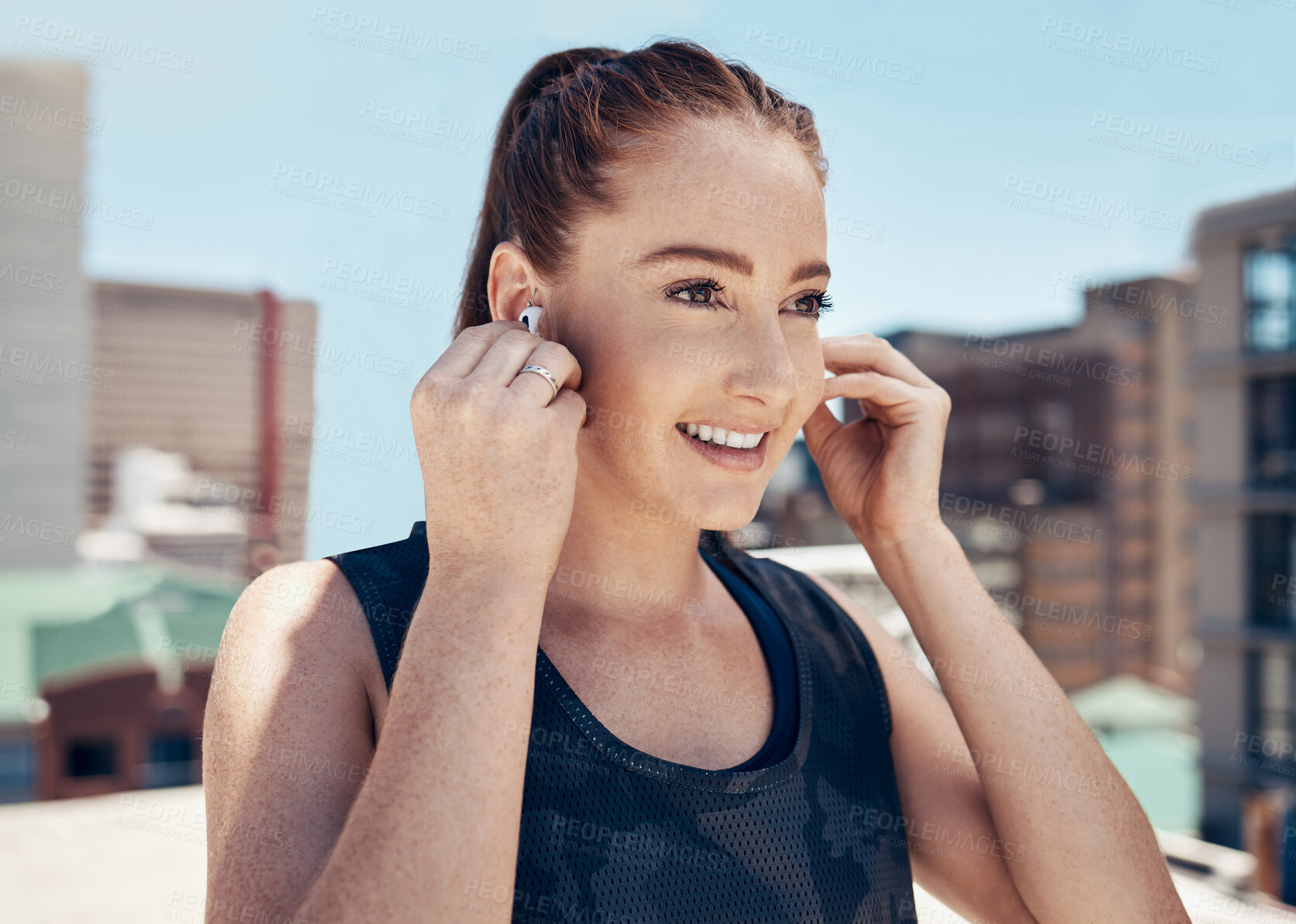 Buy stock photo Fitness, music and woman with earpods and smile on rooftop for outdoor workout, exercise or yoga. Sports, training and streaming happy motivation playlist or meditation podcast on app with headphones