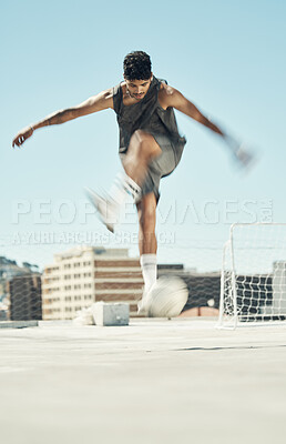 Buy stock photo Soccer, motion and man athlete, fitness and exercise, practice and training for game on outdoor pitch. Young, energy and sports, skill and ball, goal post in urban town and active lifestyle.