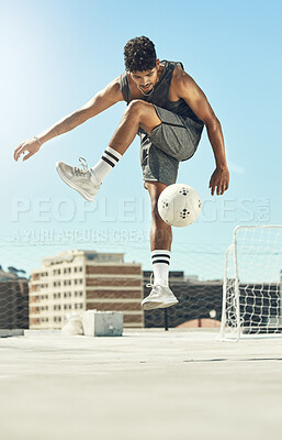 Buy stock photo Soccer, skill and man athlete training with a ball for a game or exercise on rooftop in the city. Fitness, sports and male football player jumping to practice a trick outdoor for match in urban town.