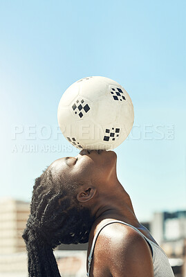 Buy stock photo Soccer, ball and head balance of a black woman doing fitness outdoor for sports. Football, exercise and workout training before a game with calm, mindfulness and relax athlete for health