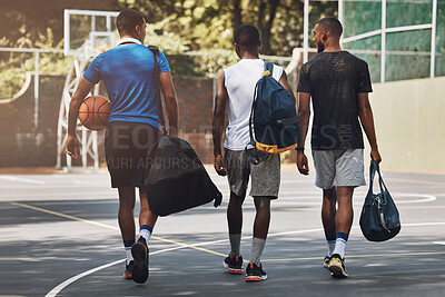 Buy stock photo Sports, Basketball and team walking to training workout on basketball court outdoors. African athlete men talking, fitness exercise and healthy sport teamwork with ball practice for competition