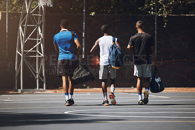 Buy stock photo Basketball court, men and friends walking in sports ground for athlete game training and workout. Black people, basketball and fitness together for team tournament preparation at outdoor court.

