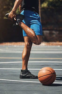 Buy stock photo Fitness, basketball and man stretching legs on outdoor court for muscle preparation with workout. Muscular, strong and athlete male with standing warm up for sports game training exercise.

