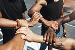 Diversity team, friends and basketball holding hands for trust, partnership or community goal on New york basketball court. Motivation, support or sports unity for fitness, training or health workout