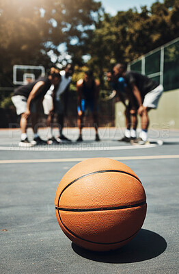 Buy stock photo Basketball, ball and outdoor court with athlete group or team talk strategy during break at game for motivation and teamwork for streetball. Male players in the USA playing for fitness and exercise