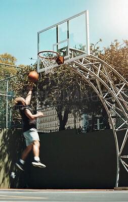 Buy stock photo Jumping man, basketball court and scoring goals in fitness workout, training or exercise for health, wellness or professional competition. Sports, energy and player in slam dunk winner game and match