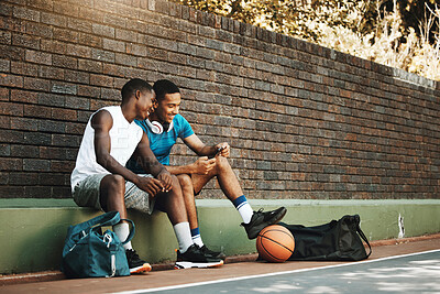 Buy stock photo Friends, phone and break after exercise, workout and basketball game in city with men bonding and laughing. Sports, rest and two guys having fun, enjoying social media comedy, post and online meme