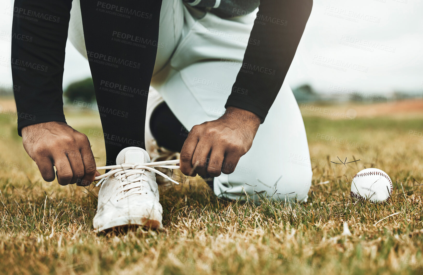 Buy stock photo Baseball, shoes and grass with ball and baseball player, sports and fitness closeup during game on baseball field. Competitive sport outdoor, exercise and workout, professional athlete and active.