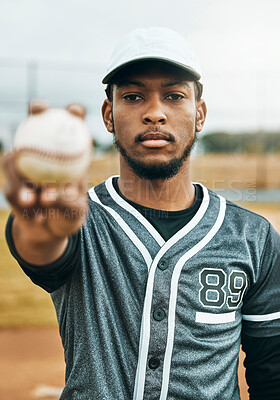 Buy stock photo Baseball, sports and ball with a black man athlete on a grass pitch or field before a game for fitness and exercise. Training, workout and health with a male baseball player ready for a game outside