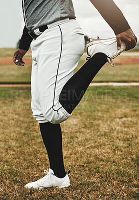 Baseball player, stretching and man on sports field doing warm up exercise, workout training at baseball field. Sports, baseball player and body preparation with athletic guy getting ready for match