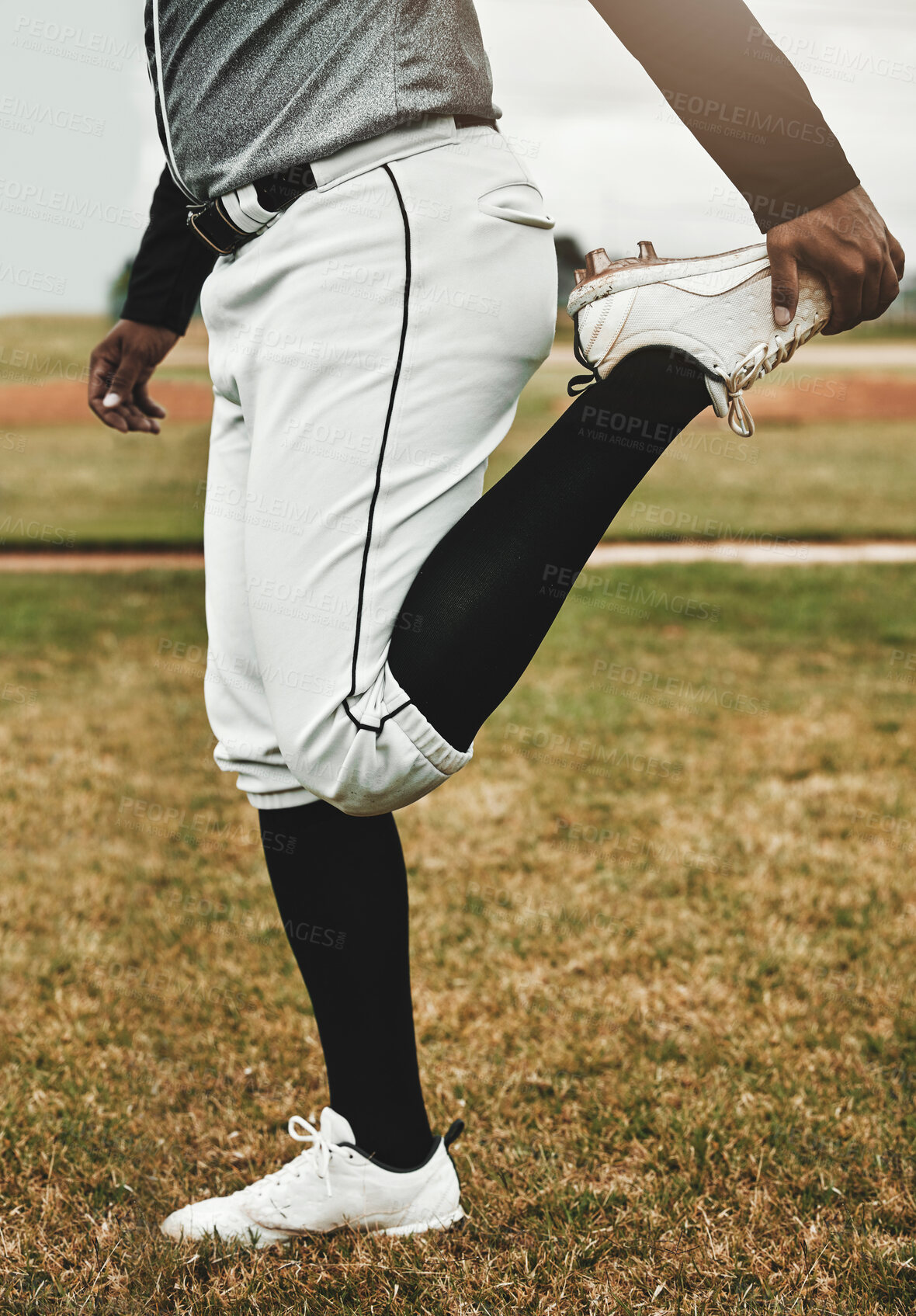 Buy stock photo Baseball player, stretching and man on sports field doing warm up exercise, workout training at baseball field. Sports, baseball player and body preparation with athletic guy getting ready for match