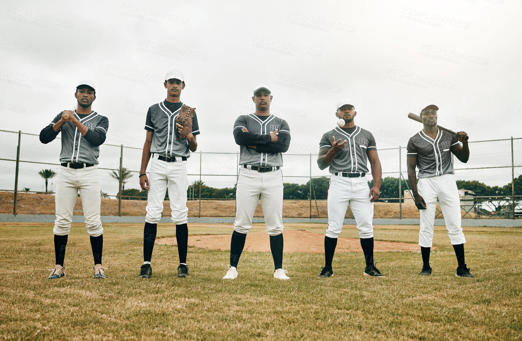 Buy stock photo Baseball player, team and baseball field, fitness and sport, sports equipment, athlete ready and motivation. Young, men and athlete, focus and serious in portrait, solidarity and confident for game.