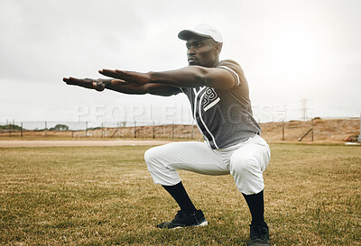 Buy stock photo Baseball player, stretching and black man on sports field doing warm up exercise, workout practice for match. African male athlete outdoor with tshirt and cap for health, wellness and energy on pitch