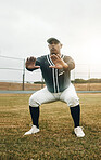 Baseball player, stretching and sports man doing squats on field for warm up exercise, workout and practice for match. Male athlete with tshirt and cap for health, wellness and energy on match pitch