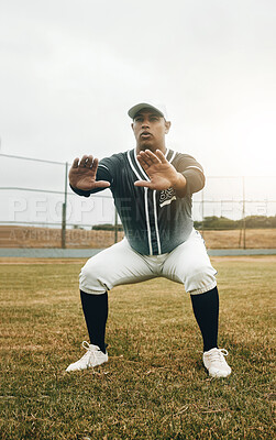 Buy stock photo Baseball player, stretching and sports man doing squats on field for warm up exercise, workout and practice for match. Male athlete with tshirt and cap for health, wellness and energy on match pitch