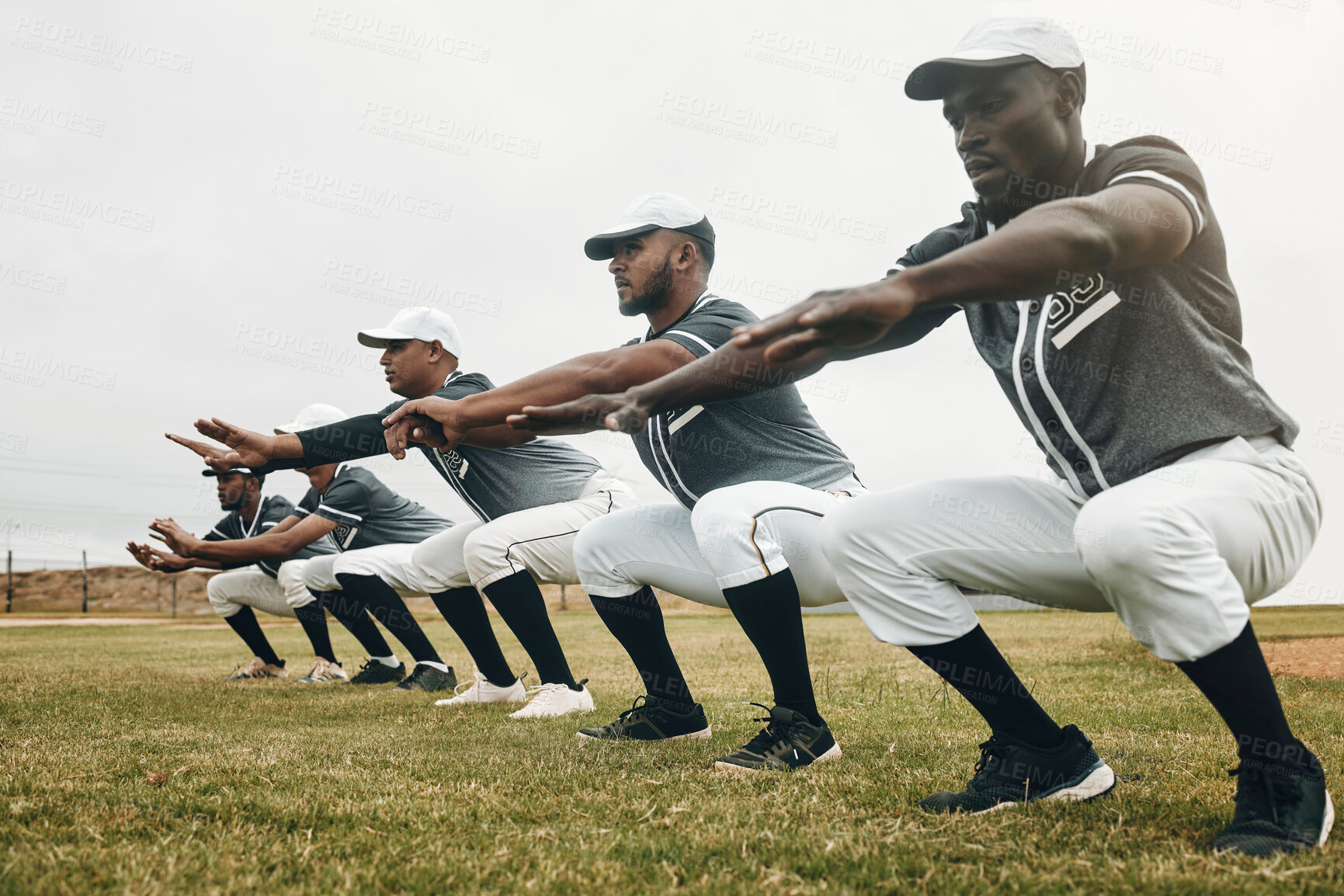 Buy stock photo Team, stretching and baseball players for game, exercise and baseball in sportswear on field. Workout, squat and group for match prepare, wellness and fitness being being focus on baseball field