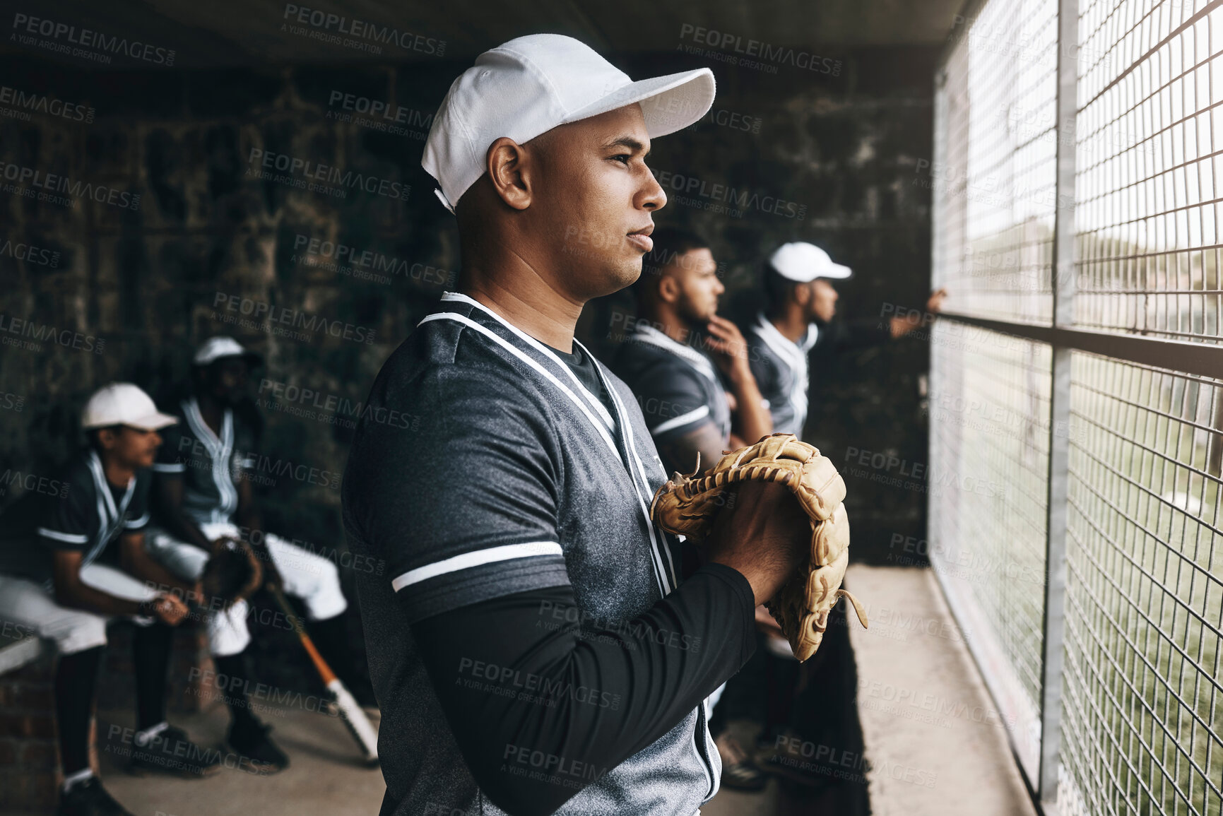 Buy stock photo Baseball, training and coach in dugout, thinking and serious ,planning and sports strategy. Sport, stadium and goal vision by team trainer watching game with baseball player group in background 