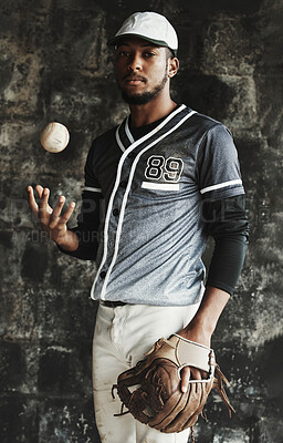 Buy stock photo Baseball, sports and uniform with a man athlete on a dark background wearing a mitt while holding a ball. Portrait, sport and confident with a male baseball player standing against a dugout wall