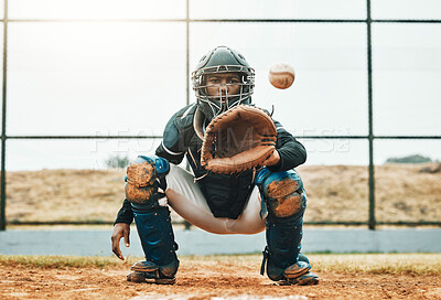Buy stock photo Baseball, catch and sports at the pitch for game, point or score with the ball on a field in the outdoors. Black man pitcher with mitt in sport training, exercise and fitness in competitive match