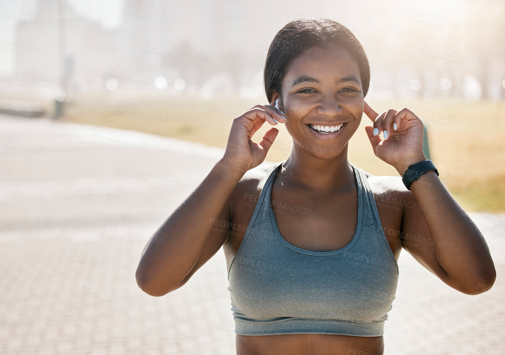 Buy stock photo Happy black woman, city running and portrait of fitness, exercise and sports training at park in morning fog outdoors. Marathon runner listening to music for energy, workout and wellness motivation