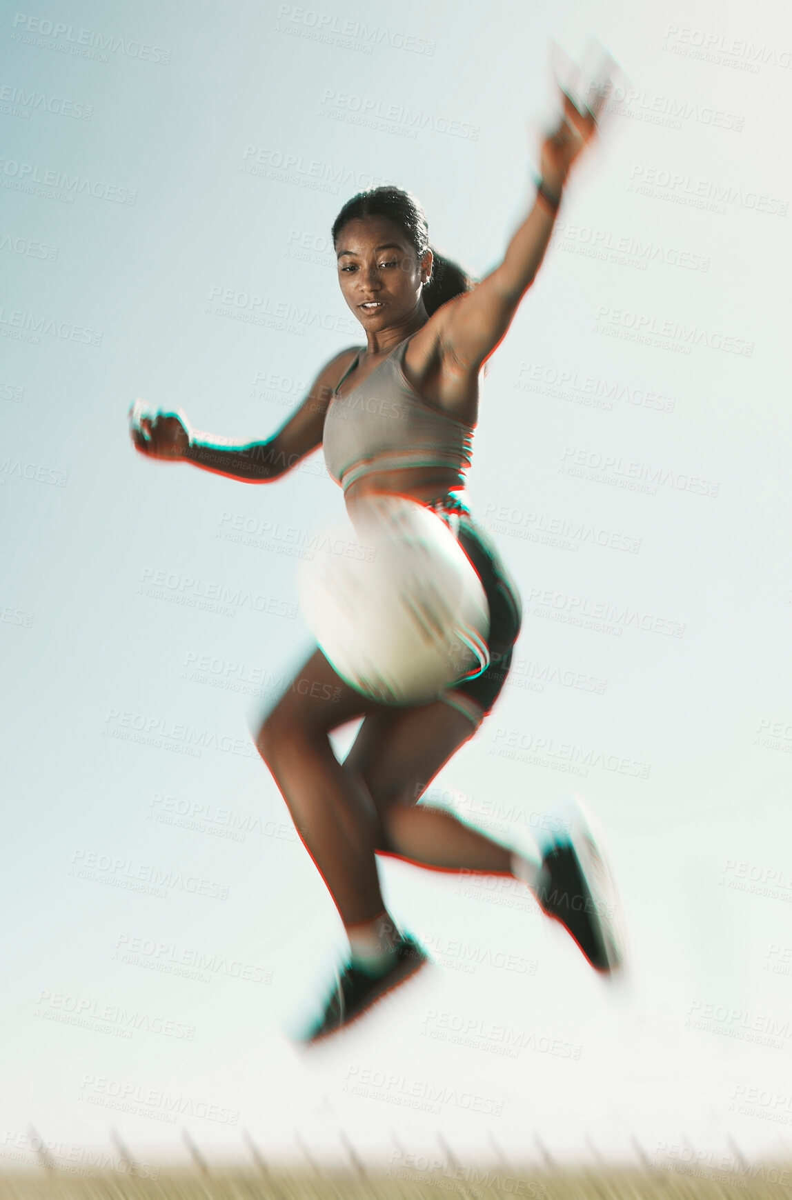 Buy stock photo Soccer, ball and athlete jumping for a trick during training for a game on outdoor sports field. Football, fitness and woman with sport skill and energy practicing with goal, motivation and exercise.