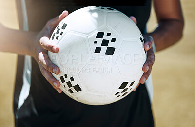 Soccer, hands and ball with a sports man on a grass pitch or field for fitness and exercise outdoor. Football, health and training with a male football player at a sport venue for a cardio workout