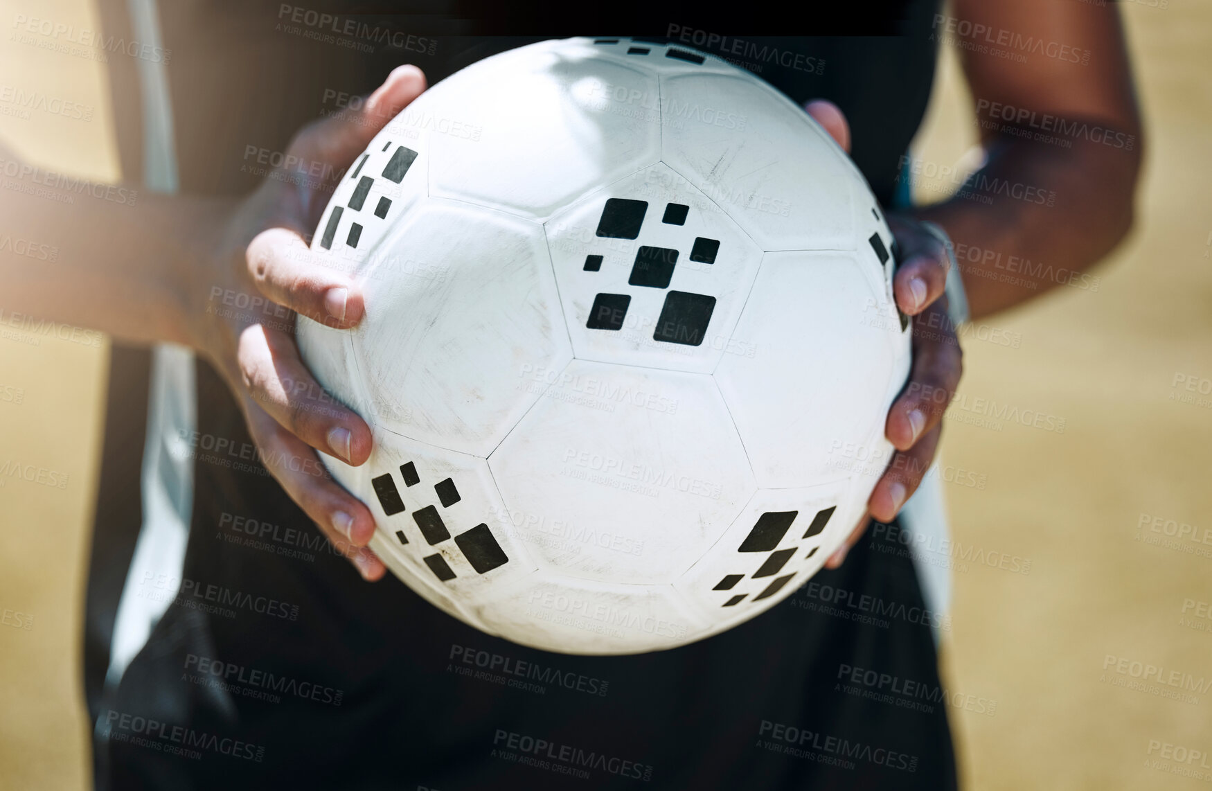 Buy stock photo Soccer, hands and ball with a sports man on a grass pitch or field for fitness and exercise outdoor. Football, health and training with a male football player at a sport venue for a cardio workout