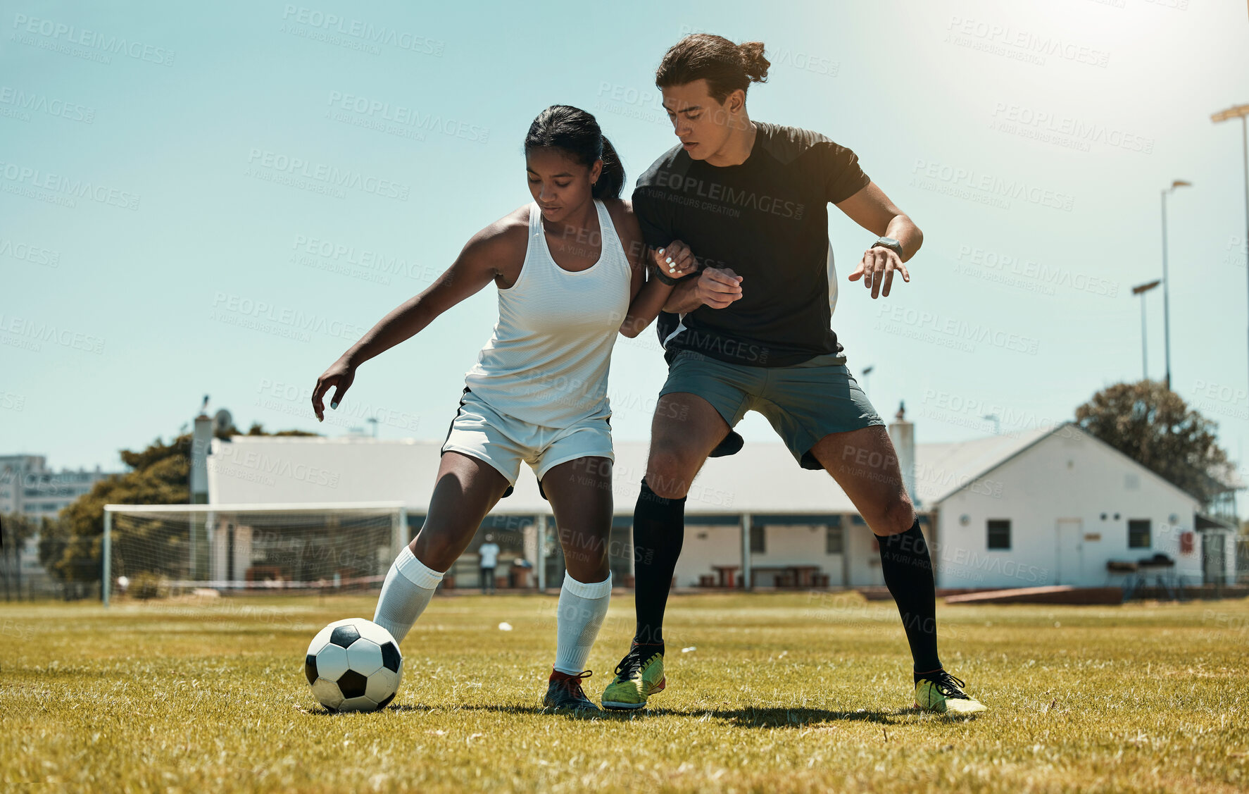 Buy stock photo Man, woman and playing soccer on grass park, stadium field and nature environment in competition match, game and challenge. Fitness friends, sports people and football players in soccer ball training