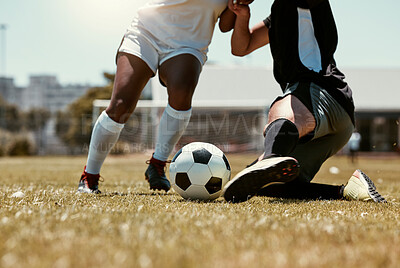 Soccer, sports and athletes playing with a ball on an outdoor field for a match or training. Fitness, men and closeup of football players legs running with skill on a pitch for a game or exercise.