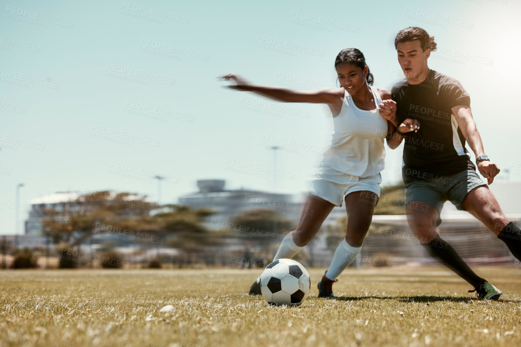 Buy stock photo Sport, friends and soccer with man and woman playing on a soccer field, competitive training for sports goal. Fitness, couple and energy with interracial guy and lady having fun with outdoor football