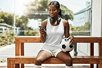 Soccer, phone and black woman football athlete with a ball on sports rest after exercise and fitness. Training workout and game break of a healthy person smile using mobile technology and 5g internet