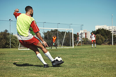 Buy stock photo Soccer, sports and men on a field during a game, training or exercise together. Athlete kicking a football during a professional competition, event or sport with team in a park for fitness in summer