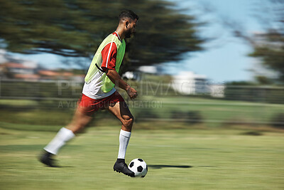 Buy stock photo Soccer, sports and man athlete in a football game on sport field running fast and kick in nature. Fitness, training and health exercise of a workout match run with a player energy and motivation