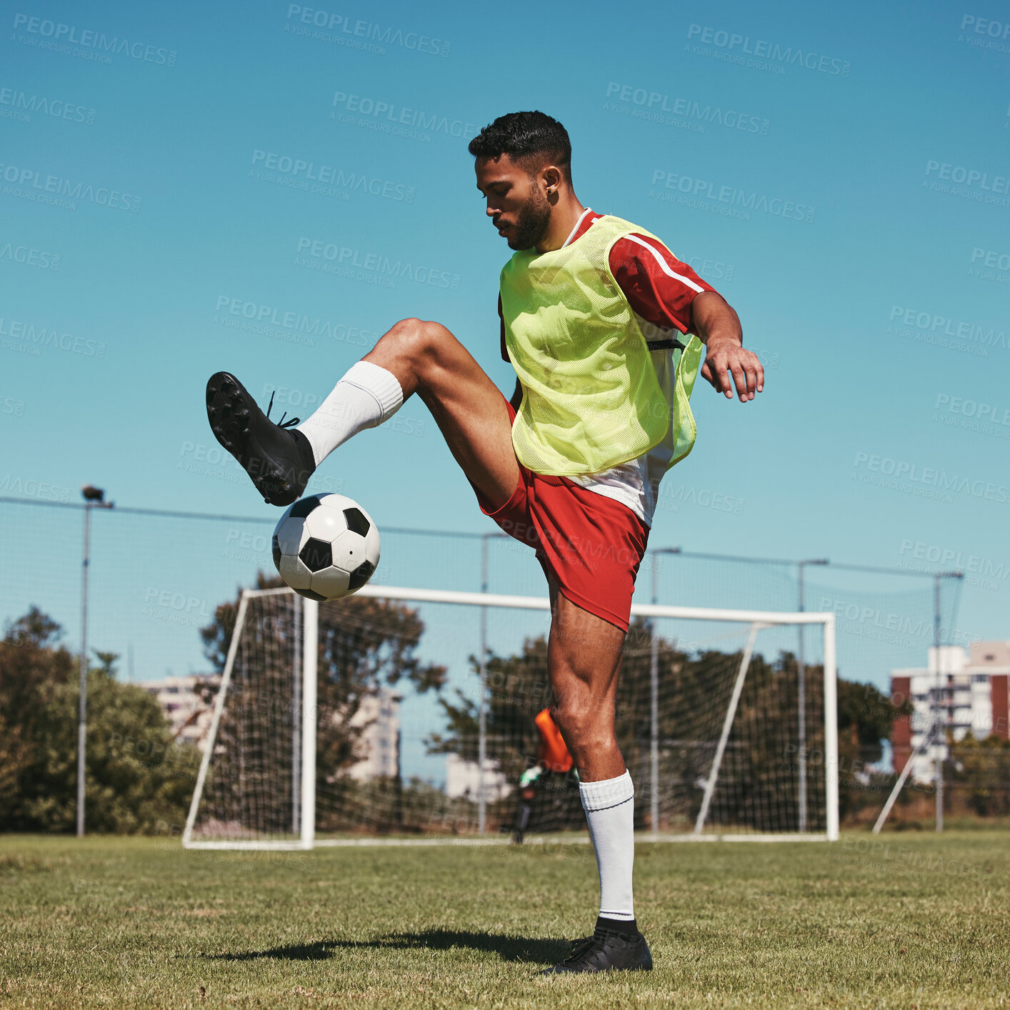 Buy stock photo Soccer, training and man with ball on soccer field for fitness, workout and sports practice. Football, energy and skill by professional athlete enjoy sport routine with soccer ball at football field
