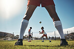 Sports, summer and soccer ball on head, young men on field during training exercise. Health, fitness and ball header at football game, players on grass together for practice workout or competition.