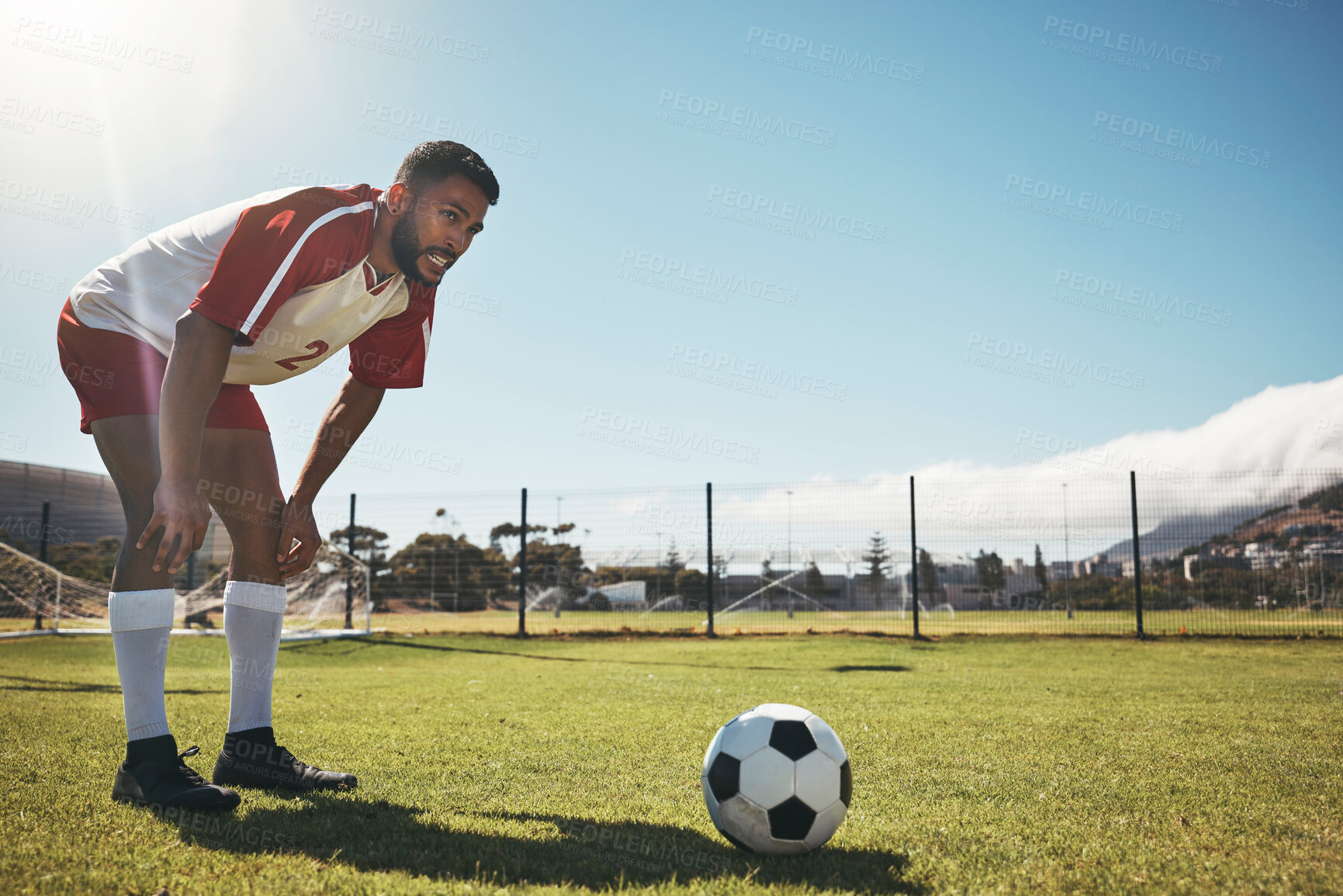 Buy stock photo Soccer training, exercise and man at soccer field with ball, getting ready to kick, workout and play competitive sports game. Football, fitness and skill by professional athlete contemplating plan