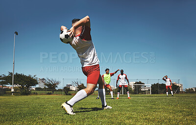Buy stock photo Football throw and field game of a team in a fitness, exercise and sports match outdoor. Training, soccer workout and athlete teamwork collaboration ready for cardio together in the summer sun