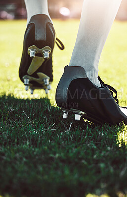 Buy stock photo Soccer shoes, soccer player and soccer field by man for training, exercise and sports game. Football field, feet and football player shoe closeup with athletic guy walking getting ready for match