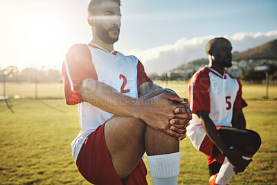 Buy stock photo Soccer, football and team stretching legs for match warm up, game or practice. Sports, group and men stretch outdoor on pitch preparing for training, exercise or workout on grass field outdoors.

