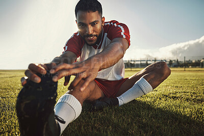 Buy stock photo Fitness, man and stretching leg on grass in nature ready for exercise or football game. Health, wellness and young male from India warm up, stretch or prepare for workout, soccer or training outdoors